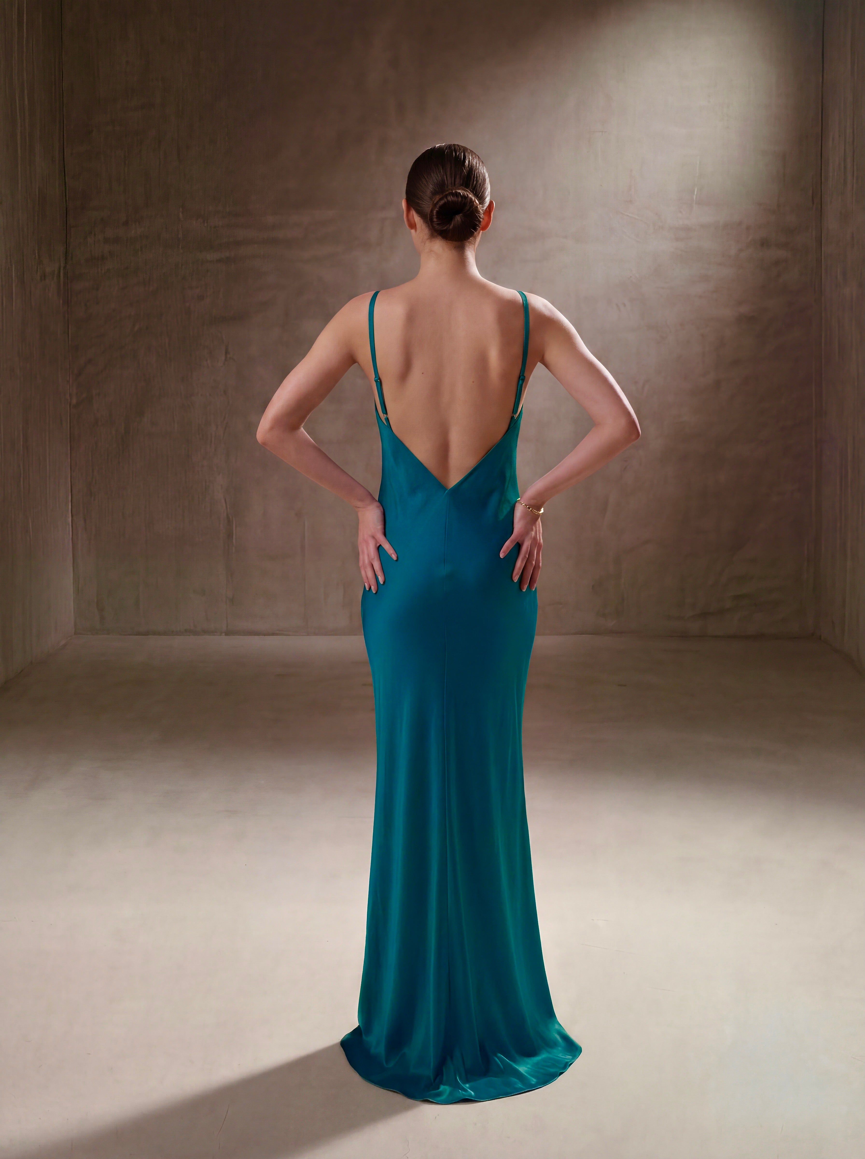 Close-up detail of the Teal silk halter gown