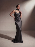 Woman wearing a Gunmetal silk slip gown, front view