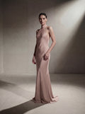 Woman wearing a Rose silk halter gown, front view