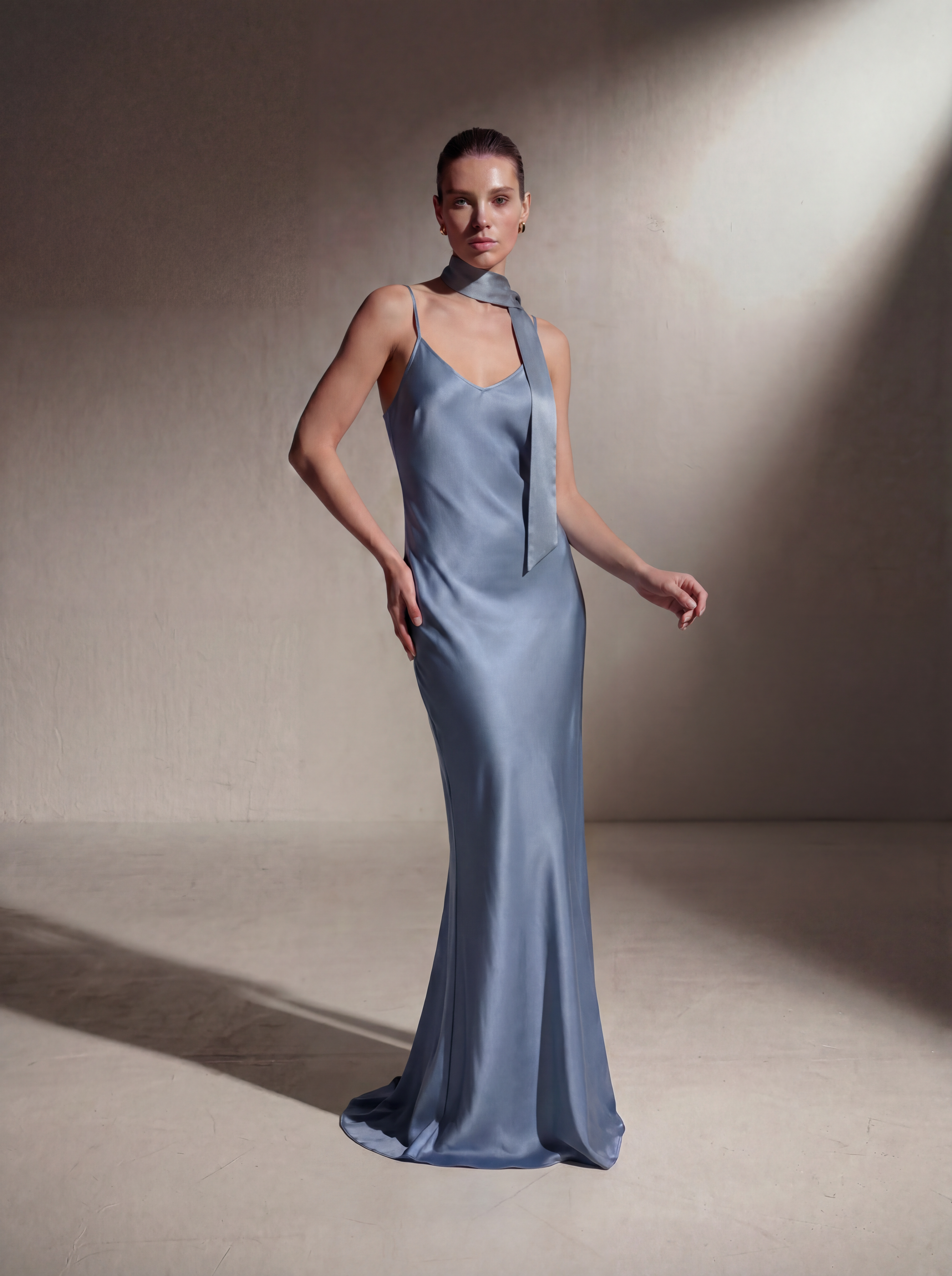 Woman wearing a Celestine silk slip gown, front view