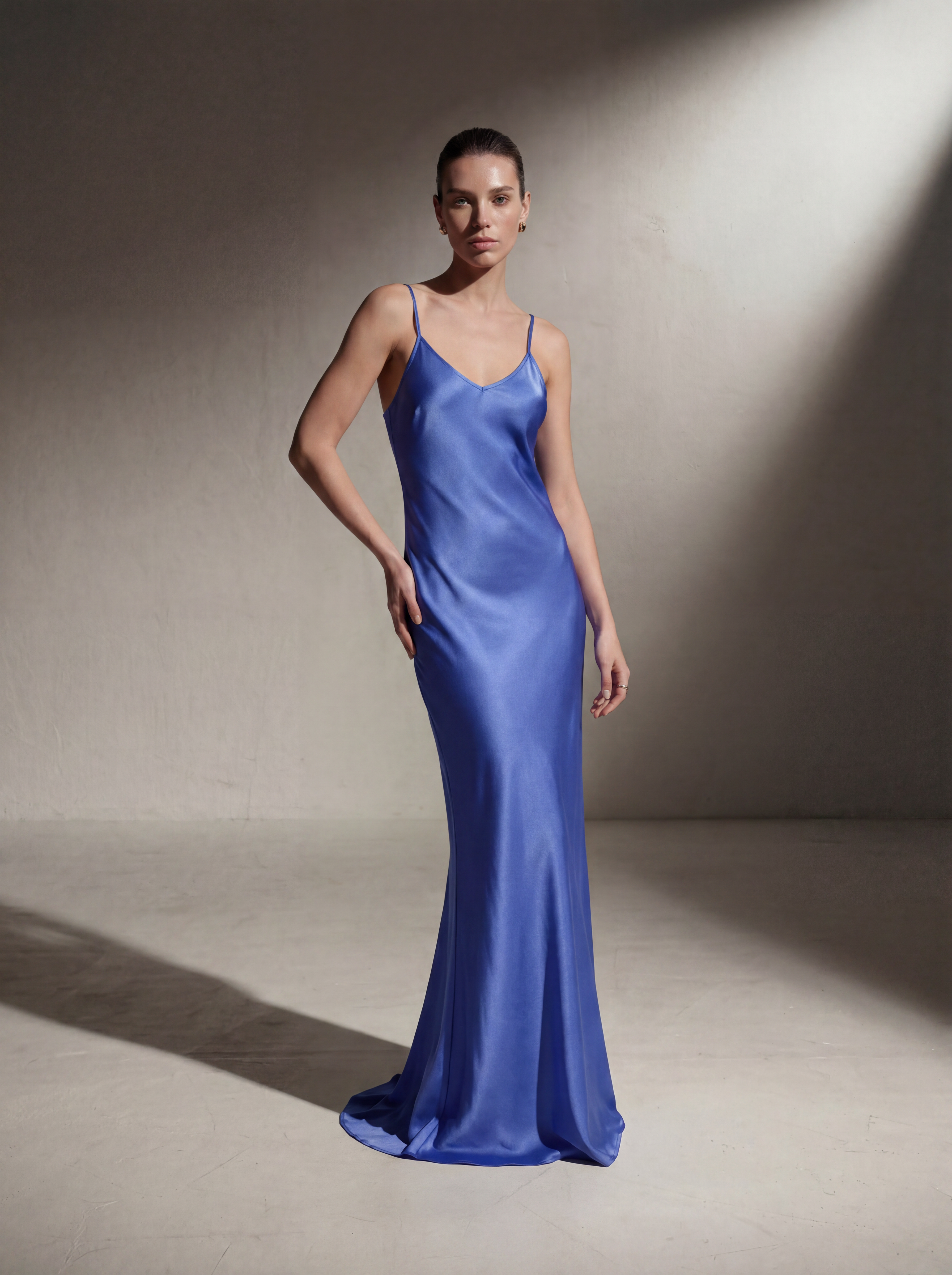 Woman wearing a Periwinkle silk slip gown, front view